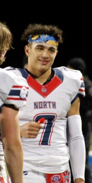 photo of Arland Bruce in his football uniform 